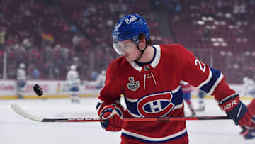 Jul 5, 2021; Montreal, Quebec, CAN; Montreal Canadiens right wing Cole Caufield (22) juggles a puck during the warmup period before game four of the 2021 Stanley Cup Final against the Tampa Bay Lightning at the Bell Centre. Mandatory Credit: Eric Bolte-USA TODAY Sports