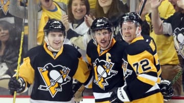 Apr 13, 2016; Pittsburgh, PA, USA; Pittsburgh Penguins left wing Conor Sheary (43) and right wing Patric Hornqvist (72) celebrate with center Sidney Crosby (87) after Crosby scored a goal against in game one of the first round of the 2016 Stanley Cup Playoffs at the CONSOL Energy Center. Mandatory Credit: Charles LeClaire-USA TODAY Sports