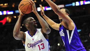 February 21, 2015; Los Angeles, CA, USA; Los Angeles Clippers forward Ekpe Udoh (13) moves to the basket against the defense of Sacramento Kings forward Eric Moreland (25) during the second half at Staples Center. Mandatory Credit: Gary A. Vasquez-USA TODAY Sports