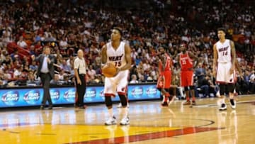 Nov 1, 2015; Miami, FL, USA; Miami Heat guard Mario Chalmers (15) shoots a technical foul during the second half against the Houston Rockets at American Airlines Arena. The Heat won 109-89. Mandatory Credit: Steve Mitchell-USA TODAY Sports