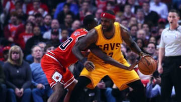 Feb 12, 2015; Chicago, IL, USA; Chicago Bulls forward Tony Snell (20) knocks the ball away from Cleveland Cavaliers forward LeBron James (23) during the second quarter at the United Center. Mandatory Credit: Mike DiNovo-USA TODAY Sports