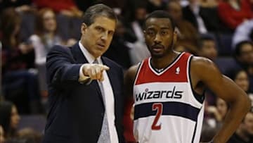 Dec 28, 2013; Washington, DC, USA; Washington Wizards head coach Randy Wittman talks with Wizards point guard John Wall (2) against the Detroit Pistons in the second quarter at Verizon Center. The Wizards won 106-82. Mandatory Credit: Geoff Burke-USA TODAY Sports