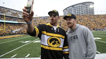 IOWA CITY, IOWA- SEPTEMBER 28: Tight end George Kittle and quarterback C.J. Beathard of the San Francisco 49ers take photos on the field during the match-up between their alma mater Iowa Hawkeyes and the Middle Tennessee Blue Raiders on September 28, 2019 at Kinnick Stadium in Iowa City, Iowa. (Photo by Matthew Holst/Getty Images)