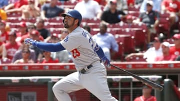 Aug 22, 2016; Cincinnati, OH, USA; Los Angeles Dodgers first baseman Adrian Gonzalez hits a solo home run against the Cincinnati Reds during the fifth inning at Great American Ball Park. Mandatory Credit: David Kohl-USA TODAY Sports