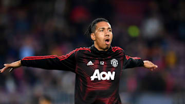 BARCELONA, SPAIN - APRIL 16: Chris Smalling of Manchester United warms up ahead of the UEFA Champions League Quarter Final second leg match between FC Barcelona and Manchester United at Camp Nou on April 16, 2019 in Barcelona, Spain. (Photo by Matthias Hangst/Getty Images)