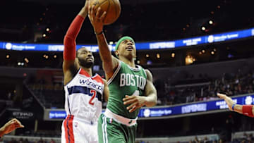 Jan 25, 2016; Washington, DC, USA; Boston Celtics guard Isaiah Thomas (4) shoots as Washington Wizards guard John Wall (2) looks on during the second half at Verizon Center. Boston Celtics won 116 - 91. Mandatory Credit: Brad Mills-USA TODAY Sports