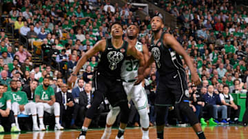 BOSTON, MA - APRIL 24: Giannis Antetokounmpo #34 of the Milwaukee Bucks Semi Ojeleye #37 of the Boston Celtics and Khris Middleton #22 of the Milwaukee Bucks box out during Game Five of Round One of the 2018 NBA Playoffs on April 24, 2018 at the TD Garden in Boston, Massachusetts. NOTE TO USER: User expressly acknowledges and agrees that, by downloading and or using this photograph, User is consenting to the terms and conditions of the Getty Images License Agreement. Mandatory Copyright Notice: Copyright 2018 NBAE (Photo by Brian Babineau/NBAE via Getty Images)