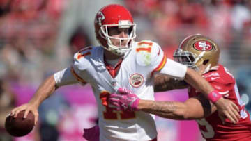 Oct 5, 2014; Santa Clara, CA, USA; Kansas City Chiefs quarterback Alex Smith (11) is pressured by San Francisco 49ers linebacker Aaron Lynch (59) at Levi