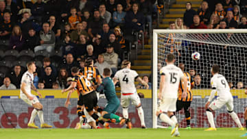 HULL, ENGLAND - SEPTEMBER 13: Ben Wilmot (L) of Stoke City heads to score during the Sky Bet Championship between Hull City and Stoke City at MKM Stadium on September 13, 2022 in Hull, United Kingdom. (Photo by Nigel Roddis/Getty Images)