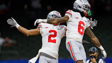 Ohio State Buckeyes wide receiver Jameson Williams (6) celebrates his touchdown with wide receiver Chris Olave (2) against Clemson Tigers in the fourth quarter during the College Football Playoff semifinal at the Allstate Sugar Bowl in the Mercedes-Benz Superdome in New Orleans on Friday, Jan. 1, 2021.College Football Playoff Ohio State Faces Clemson In Sugar Bowl