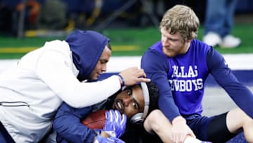 ARLINGTON, TX - JANUARY 15: Dak Prescott #4 (L), Ezekiel Elliott #21, and Cole Beasley #11 of the Dallas Cowboys relax before the NFC Divisional Playoff Game against the Green Bay Packers at AT&T Stadium on January 15, 2017 in Arlington, Texas. (Photo by Joe Robbins/Getty Images)