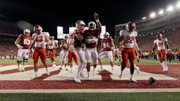 MADISON, WI - AUGUST 31: Jonathan Taylor #23 of the Wisconsin Badgers celebrates with teammates after scoring a touchdown in the first quarter against the Western Kentucky Hilltoppers at Camp Randall Stadium on August 31, 2018 in Madison, Wisconsin. (Photo by Dylan Buell/Getty Images)