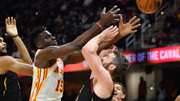 Dec 31, 2021; Cleveland, Ohio, USA; Atlanta Hawks center Clint Capela (15) and Cleveland Cavaliers forward Kevin Love (0) battle for a rebound during the second half at Rocket Mortgage FieldHouse. Mandatory Credit: Ken Blaze-USA TODAY Sports