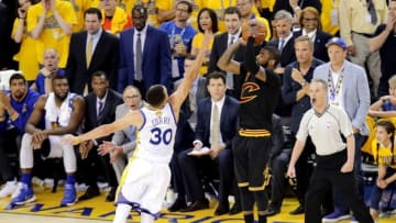 Jun 19, 2016; Oakland, CA, USA; Cleveland Cavaliers guard Kyrie Irving (2) shoots the the game winning shot during the fourth quarter against Golden State Warriors guard Stephen Curry (30) in game seven of the NBA Finals at Oracle Arena. Mandatory Credit: Kelley L Cox-USA TODAY Sports