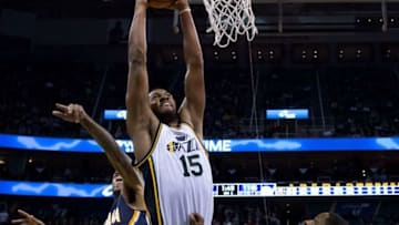 Dec 5, 2015; Salt Lake City, UT, USA; Utah Jazz forward Derrick Favors (15) goes up for a dunk in front of Indiana Pacers center Jordan Hill (27) during overtime at Vivint Smart Home Arena. The Jazz won 122-119. Mandatory Credit: Russ Isabella-USA TODAY Sports