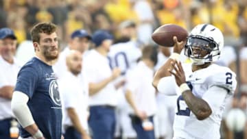 IOWA CITY, IOWA- OCTOBER 9: Injured quarterback Sean Clifford of the Penn State Nittany Lions watches backup quarterback Ta'Quan Boberson #2 get loose during the second half against the Iowa Hawkeyes at Kinnick Stadium on October 9, 2021 in Iowa City, Iowa. (Photo by Matthew Holst/Getty Images)