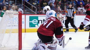 Mar 17, 2016; Glendale, AZ, USA; Arizona Coyotes goalie Mike Smith (41) makes a save against San Jose Sharks right wing Joel Ward (42) during the third period at Gila River Arena. Mandatory Credit: Matt Kartozian-USA TODAY Sports