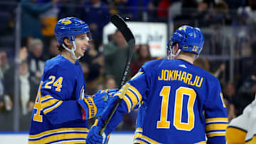 Mar 21, 2023; Buffalo, New York, USA; Buffalo Sabres center Dylan Cozens (24) celebrates bis goal with defenseman Henri Jokiharju (10) during the second period against the Nashville Predators at KeyBank Center. Mandatory Credit: Timothy T. Ludwig-USA TODAY Sports