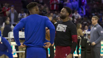 Jimmy Butler #23 of the Philadelphia 76ers talks to Dwyane Wade #3 of the Miami Heat (Photo by Mitchell Leff/Getty Images)