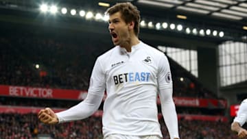 LIVERPOOL, ENGLAND - JANUARY 21: Fernando Llorente of Swansea City celebrates his sides third goal scored by Gylfi Sigurdsson during the Premier League match between Liverpool and Swansea City at Anfield on January 21, 2017 in Liverpool, England. (Photo by Athena Pictures/Getty Images)