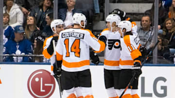 TORONTO, ON - NOVEMBER 9: Oskar Lindblom #23 of the Philadelphia Flyers celebrates his goal against the Toronto Maple Leafs with teammates Travis Konecny #11 and Sean Couturier #14 during the first period at the Scotiabank Arena on November 9, 2019 in Toronto, Ontario, Canada. (Photo by Mark Blinch/NHLI via Getty Images)