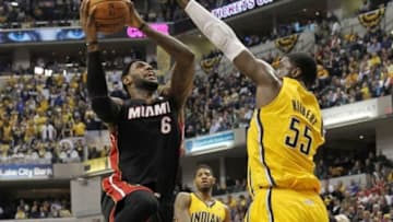 Mar 26, 2014; Indianapolis, IN, USA; Miami Heat forward LeBron James (6) drives to the basket with Indiana Pacers center Roy Hibbert (55) defending during the second quarter at Bankers Life Fieldhouse. Mandatory Credit: Pat Lovell-USA TODAY Sports