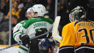 Feb 15, 2016; Nashville, TN, USA; Dallas Stars center Tyler Seguin (91) celebrates after the game winning goal by Stars center Mattias Janmark (13) in overtime against Nashville Predators defenseman Roman Josi (59) and goalie Carter Hutton (30) at Bridgestone Arena. The Stars won 3-2 in overtime. Mandatory Credit: Christopher Hanewinckel-USA TODAY Sports