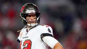TAMPA, FLORIDA - JANUARY 16: Tom Brady #12 of the Tampa Bay Buccaneers warms up prior to a game against the Dallas Cowboys in the NFC Wild Card playoff game at Raymond James Stadium on January 16, 2023 in Tampa, Florida. (Photo by Mike Ehrmann/Getty Images)