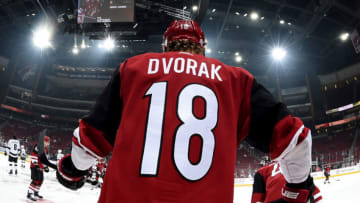 GLENDALE, ARIZONA - NOVEMBER 18: Christian Dvorak #18 of the Arizona Coyotes prepares for a game against the Los Angeles Kings at Gila River Arena on November 18, 2019 in Glendale, Arizona. (Photo by Norm Hall/NHLI via Getty Images)