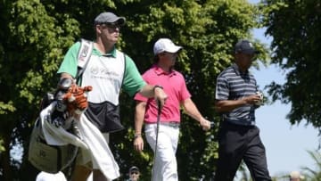 March 07, 2013; Miami, FL, USA; Tiger Woods and Rory McIlroy walk down the 16th fairway at the WGC Cadillac Championship at Trump Doral Golf Club. Mandatory Credit: Brad Barr-USA TODAY Sports