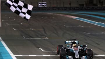 ABU DHABI, UNITED ARAB EMIRATES - NOVEMBER 26: Lewis Hamilton of Great Britain and Mercedes GP crosses the line during the Abu Dhabi Formula One Grand Prix at Yas Marina Circuit on November 26, 2017 in Abu Dhabi, United Arab Emirates. (Photo by Mark Thompson/Getty Images)