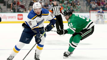DALLAS, TEXAS - OCTOBER 05: Jordan Kyrou #25 of the St. Louis Blues controls the puck against Tyler Seguin #91 of the Dallas Stars in the second period of a preseason NHL game at American Airlines Center on October 05, 2021 in Dallas, Texas. (Photo by Tom Pennington/Getty Images)