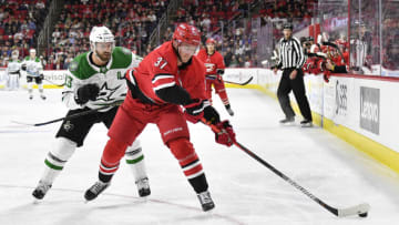 RALEIGH, NORTH CAROLINA - FEBRUARY 25: Blake Comeau #15 of the Dallas Stars defends Andrei Svechnikov #37 of the Carolina Hurricanes during the third period of their game at PNC Arena on February 25, 2020 in Raleigh, North Carolina. The Stars won 4-1. (Photo by Grant Halverson/Getty Images)