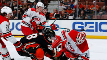 ANAHEIM, CA - DECEMBER 11: Derek Grant #38 of the Anaheim Ducks puts the puck on net for a goal against Scott Darling #33, Justin Faulk #27, and Haydn Fleury #4 of the Carolina Hurricanes during the game on December 11, 2017 at Honda Center in Anaheim, California. (Photo by Debora Robinson/NHLI via Getty Images)
