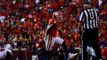 CLEMSON, SC - OCTOBER 20: Running back Travis Etienne #9 of the Clemson Tigers rushes for a touchdown against the North Carolina State Wolfpack during the third quarter of the football game at Clemson Memorial Stadium on October 20, 2018 in Clemson, South Carolina. (Photo by Mike Comer/Getty Images)