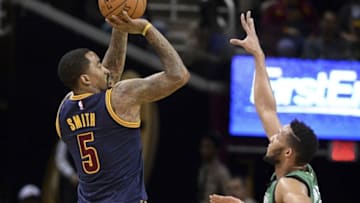 Feb 5, 2016; Cleveland, OH, USA; Cleveland Cavaliers guard J.R. Smith (5) shoots over Boston Celtics guard Evan Turner (11) during the second quarter at Quicken Loans Arena. Mandatory Credit: Ken Blaze-USA TODAY Sports
