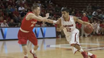 Nov 24, 2013; Charleston, SC, USA; Davidson Wildcats guard Jack Gibbs (12) drives the ball inside during the first half against the New Mexico Lobos at TD Arena. Mandatory Credit: Jeremy Brevard-USA TODAY Sports