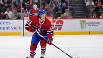 Oct 14, 2023; Montreal, Quebec, CAN; Montreal Canadiens forward Rafael Harvey-Pinard (49) plays the puck during the first period of the game against the Chicago Blackhawks at the Bell Centre. Mandatory Credit: Eric Bolte-USA TODAY Sports