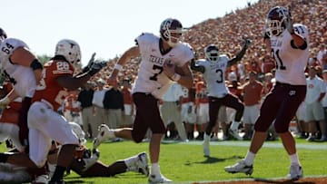 AUSTIN, TX - NOVEMBER 24: Quarterback Stephen McGee #7 of the Texas A&M Aggies runs for a touchdown against the Texas Longhorns at Darrell K Royal-Texas Memorial Stadium November 24, 2006 in Austin, Texas. The Aggies defeated the Longhorns 12-7. (Photo by Ronald Martinez/Getty Images)