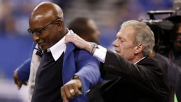 Dec 15, 2013; Indianapolis, IN, USA; Indianapolis Colts owner Jim Irsay presents Eric Dickerson a blue jacket as he is inducted into the Colts Ring of Honor at halftime of the game against the Houston Texans at Lucas Oil Stadium. Indianapolis defeats Houston 25-3. Mandatory Credit: Brian Spurlock-USA TODAY Sports