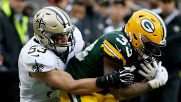 GREEN BAY, WI - OCTOBER 22: A.J. Klein #53 of the New Orleans Saints tackles Aaron Jones #33 of the Green Bay Packers in the fourth quarter at Lambeau Field on October 22, 2017 in Green Bay, Wisconsin. (Photo by Dylan Buell/Getty Images)