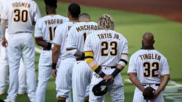 SAN DIEGO, CALIFORNIA - JULY 24: Manager Jayce Tingler and Fernando Tatis Jr. #23 of the San Diego Padres line up during the National Anthem prior to the Opening Day game against the Arizona Diamondbacks at PETCO Park on July 24, 2020 in San Diego, California. (Photo by Sean M. Haffey/Getty Images)