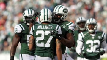 Dec 1, 2013; East Rutherford, NJ, USA; New York Jets corner back Dee Milliner (27) is congratulated by teammates after breaking up a pass by the Miami Dolphins during the first quarter of a game at MetLife Stadium. Mandatory Credit: Brad Penner-USA TODAY Sports
