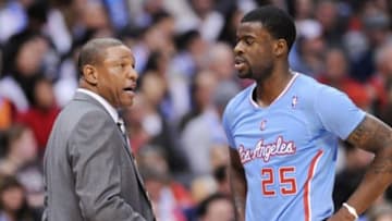 Nov 24, 2013; Los Angeles, CA, USA; Los Angeles Clippers head coach Doc Rivers talks to Los Angeles Clippers shooting guard Reggie Bullock (25) during the first half of the game against the Chicago Bulls at Staples Center. Clippers won 121-82. Mandatory Credit: Jayne Kamin-Oncea-USA TODAY Sports