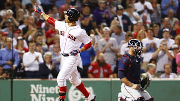 BOSTON, MA - JUNE 29: Chris Gimenez #38 of the Minnesota Twins looks on as Mookie Betts #50 of the Boston Red Sox reacts after hitting a solo home run in the fourth inning of a game against the Minnesota Twins at Fenway Park on June 29, 2017 in Boston, Massachusetts. (Photo by Adam Glanzman/Getty Images)