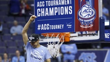 Mar 12, 2016; Washington, DC, USA; North Carolina Tar Heels guard Marcus Paige (5) celebrates with a piece of the net after the Tar Heels