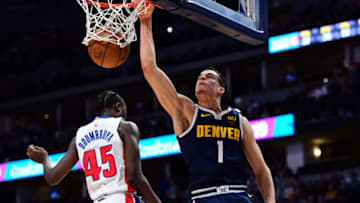 Feb 25, 2020; Denver, Colorado, USA; Denver Nuggets forward Michael Porter Jr. (1) scores a basket over Detroit Pistons forward Sekou Doumbouya (45) in the second quarter at the Pepsi Center. Mandatory Credit: Ron Chenoy-USA TODAY Sports