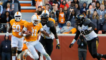 Nov 19, 2016; Knoxville, TN, USA; Tennessee Volunteers quarterback Joshua Dobbs (11) runs the ball against the Missouri Tigers during the second quarter at Neyland Stadium. Mandatory Credit: Randy Sartin-USA TODAY Sports