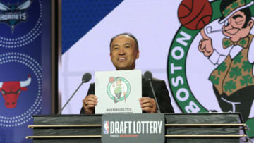 CHICAGO, IL - MAY 14: Deputy Commissioner of the NBA, Mark Tatum, holds up the card for the Boston Celtics after they get the 14th overall pick in the NBA Draft during the 2019 NBA Draft Lottery on May 14, 2019 at the Chicago Hilton in Chicago, Illinois. NOTE TO USER: User expressly acknowledges and agrees that, by downloading and/or using this photograph, user is consenting to the terms and conditions of the Getty Images License Agreement. Mandatory Copyright Notice: Copyright 2019 NBAE (Photo by Gary Dineen/NBAE via Getty Images)