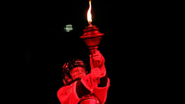 MONTREAL, QC - MAY 19: A young boy dressed as a hockey player holds a torch prior to Game Two of the Eastern Conference Final between the New York Rangers and the Montreal Canadiens during the 2014 Stanley Cup Playoffs at Bell Centre on May 19, 2014 in Montreal, Canada. (Photo by Bruce Bennett/Getty Images)